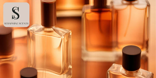 Collection of amber-hued perfume bottles with black caps on a reflective surface - Seraphine Scents