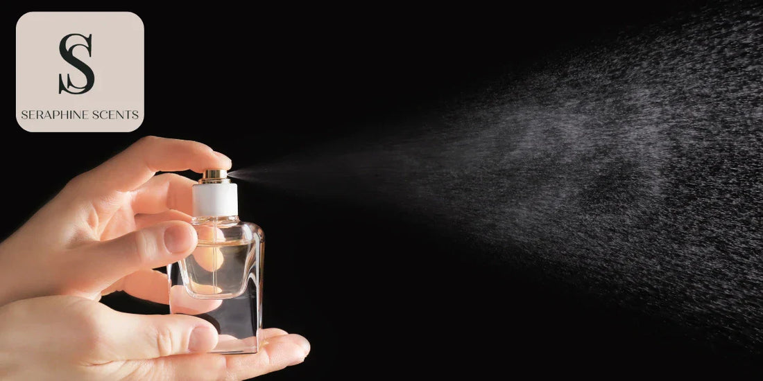 Hand spraying perfume from glass bottle into fine mist - Seraphine Scents