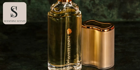 Elegant gold-capped perfume bottle labeled White Linen with matching case on dark marble background - Seraphine Scents