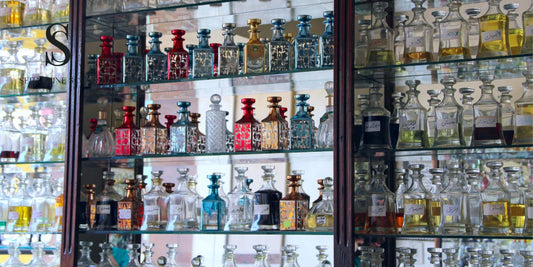 A display of colorful, authentic perfume bottles in a Singapore online store.