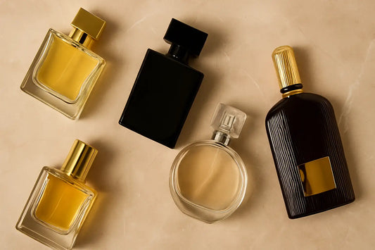 Luxury men’s perfume bottles arranged on marble, showcasing best scents for modern masculinity