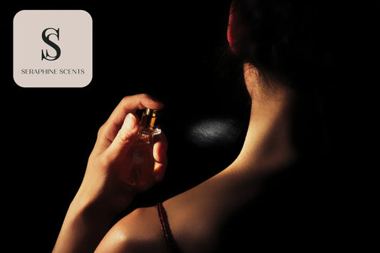 Woman spraying perfume on her neck in a dark setting, representing luxury fragrances offered by Seraphine Scents in Singapore.