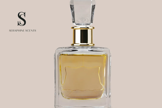 Luxury clear glass perfume bottle with golden liquid on a soft beige background – Seraphine Scents Singapore