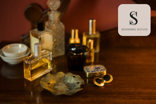 Luxury perfume bottles on a wooden table with Seraphine Scents branding